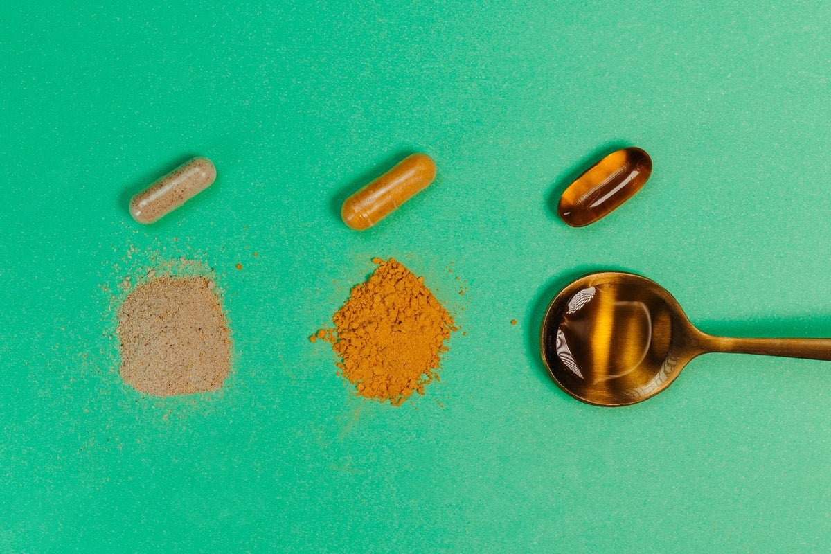 Side-by-side curcumin powder and capsules comparing standard and enhanced delivery forms