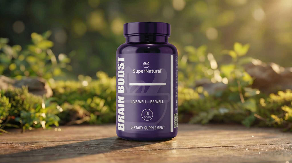 SuperNatural BrainBoost bottle sitting on a table with information about the dietary supplement containing BioSoluble Curcumin with Advanced Cognitive Support